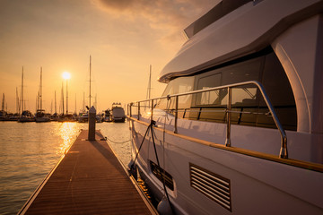Luxury yachts rest in the port at sunset in pattaya thailand.