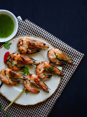 Grilled shrimps on white dish