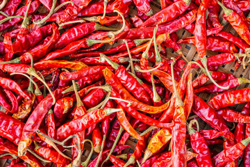 Dried red hot chilli pepper closeup background