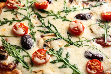 Delicious pizza with arugula and cherry tomatoes, closeup