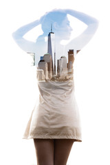 Double exposure. A healthy girl with her hands on her head combined with photograph of New York City skyline