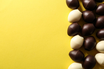 Chocolate Easter eggs on color background