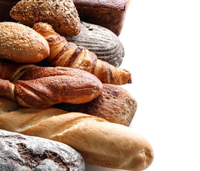 Freshly baked bread products on white background