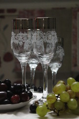 glass of white wine and grapes on table