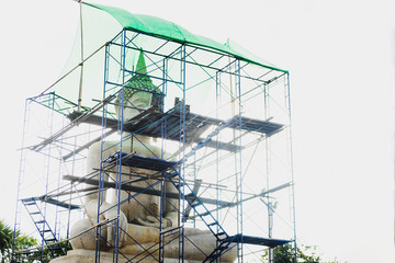 Repair Buddha statue with bright light under construction