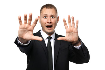 Businessman having panic attack on white background