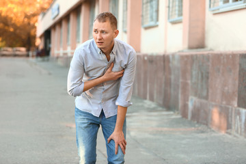 Man having panic attack outdoors