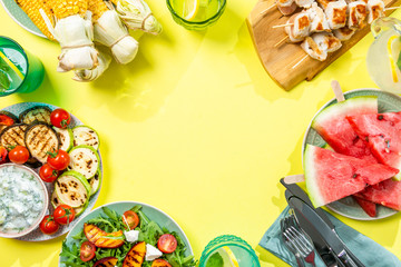 Summer bbq party concept - grilled chicken, vegetables, corn, salad, top view, copy space