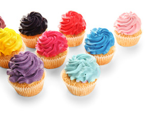Colorful cupcakes on white background