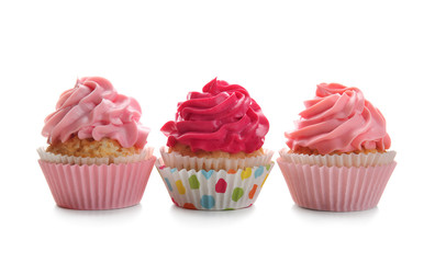 Colorful cupcakes on white background