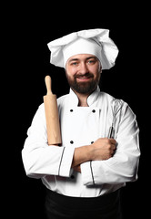Male chef on dark background
