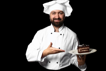 Male chef with tasty dish on dark background