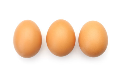 Raw chicken eggs on white background