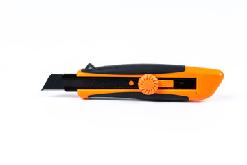 Orange and back paper knife or cutter on white background