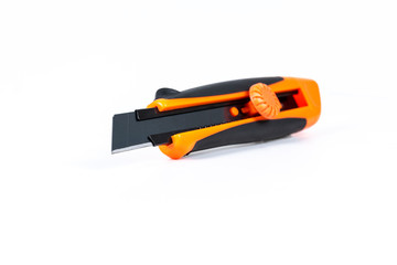 Orange and back paper knife or cutter on white background