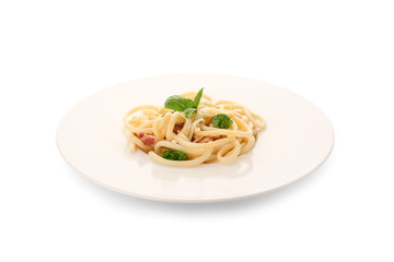 Plate with delicious pasta carbonara on white background