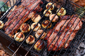 Pork meat cooking on the grill