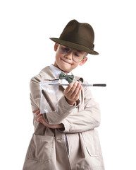 Cute little detective with evidence on white background