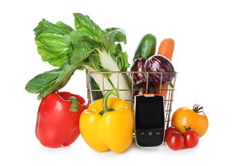 Digital glucometer with healthy food on white background. Diabetes diet