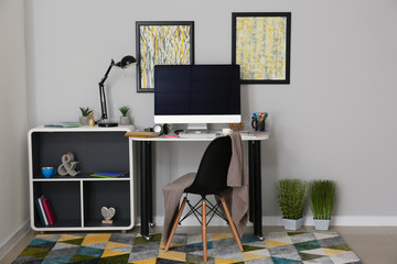 Stylish workplace of designer with modern computer
