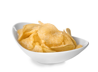 Bowl with tasty crispy potato chips on white background