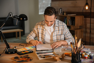 Young designer working in office