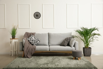 Soft sofa in interior of living room