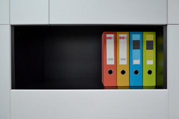 Office folders for documents on the shelf