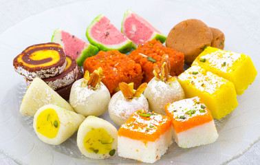 Indian Traditional Mix Sweet Food or Mix Mithai include Peda, Mawa Burfi, Dry Fruits Sweet, Halwa or Coconut Burfi