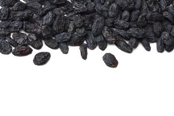 black raisins isolated on white background. top view