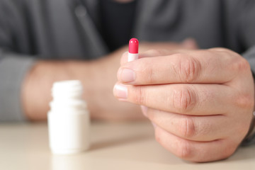 Man takes the antidepressants capsule