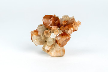 Macro photo of natural mineral rock - aragonite crystal on white background, Morocco