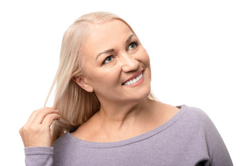 Portrait of beautiful mature woman on white background