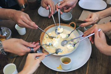 Friend eating together Bing su (Korean shaved ice) for meeting top view. People eating sweet dessert get together.