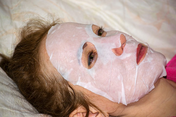 woman makes facial care procedure