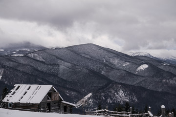 House on the mountain valley in winter