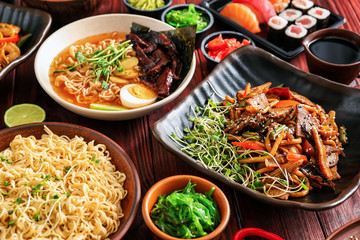 Assortment of Chinese food on wooden table