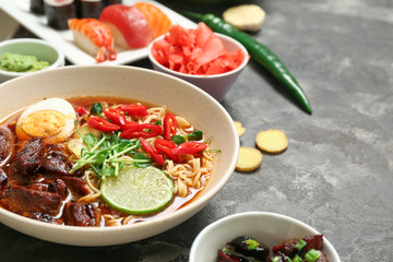 Assortment of Chinese food on grey table