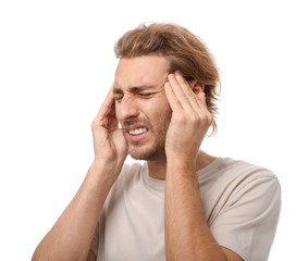 Naklejka premium Young man suffering from headache on white background