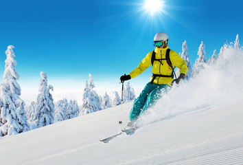 Young man skiing on piste