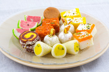 Indian Traditional Mix Sweet Food or Mix Mithai include Peda, Mawa Burfi, Dry Fruits Sweet, Halwa or Coconut Burfi