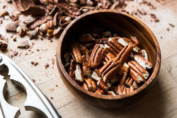 Peeled Pecan Nuts in Wooden Bowl without Shell / Walnuts.