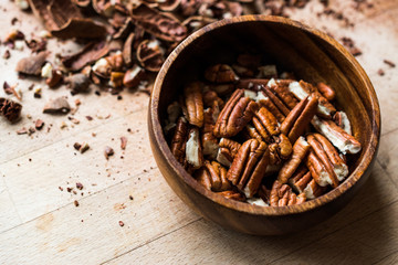 Peeled Pecan Nuts in Wooden Bowl without Shell / Walnuts.
