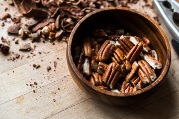 Peeled Pecan Nuts in Wooden Bowl without Shell / Walnuts.
