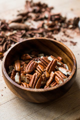 Peeled Pecan Nuts in Wooden Bowl without Shell / Walnuts.