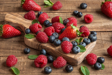 Fresh fruit salad on wooden table