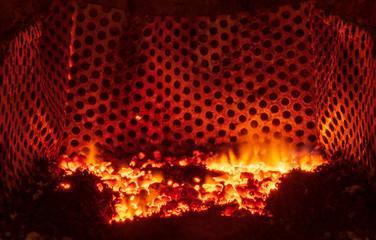Burning pellets in a fireplace