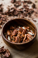 Peeled Pecan Nuts in Wooden Bowl without Shell / Walnuts.