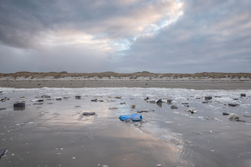 Environmental damage on island Terschelling the Netherlands containers in ocean