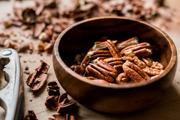 Peeled Pecan Nuts in Wooden Bowl without Shell / Walnuts.
